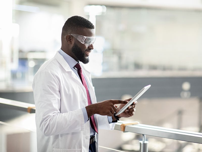 African-american-medical-scientist-using-digital-tablet